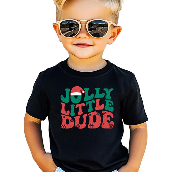 Front view of boys festive black Christmas shirt with Jolly Little Dude snowflake graphic