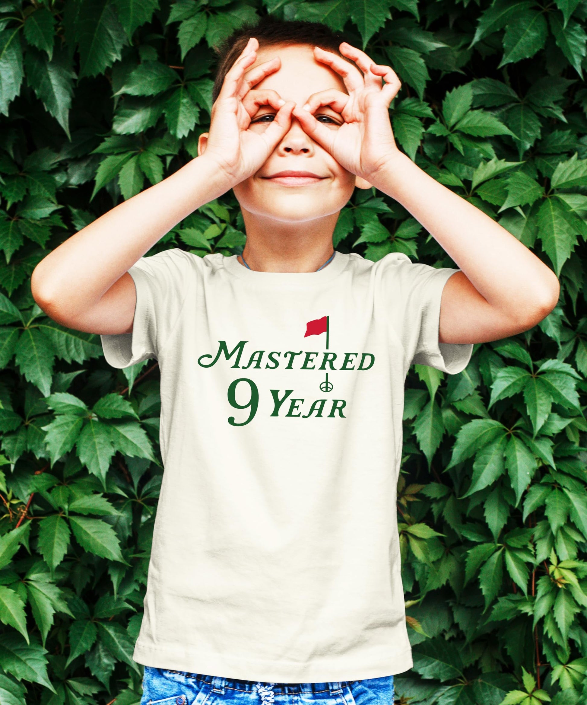 Close-up of Mastered 9 Years golf graphic print on kids birthday t-shirt