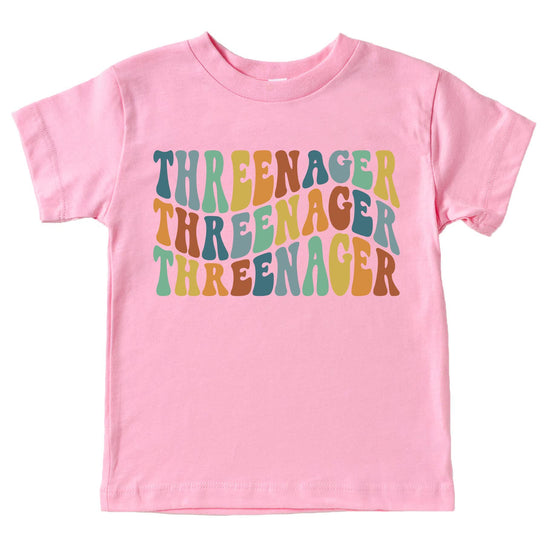 Close-up of Threenager groovy birthday graphic print on toddler shirt in royal blue
