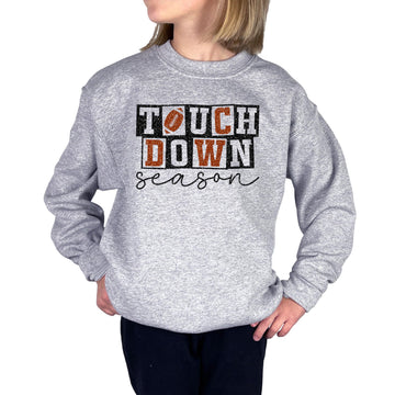 Grey pullover sweatshirt with faux glitter football touchdown season graphic for girls and women