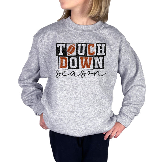 Grey pullover sweatshirt with faux glitter football touchdown season graphic for girls and women