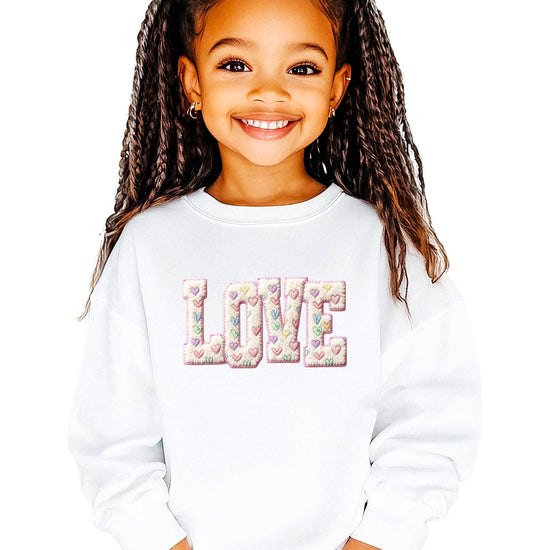 Women modeling girly pink Valentine pullover sweatshirt with retro graphic print
