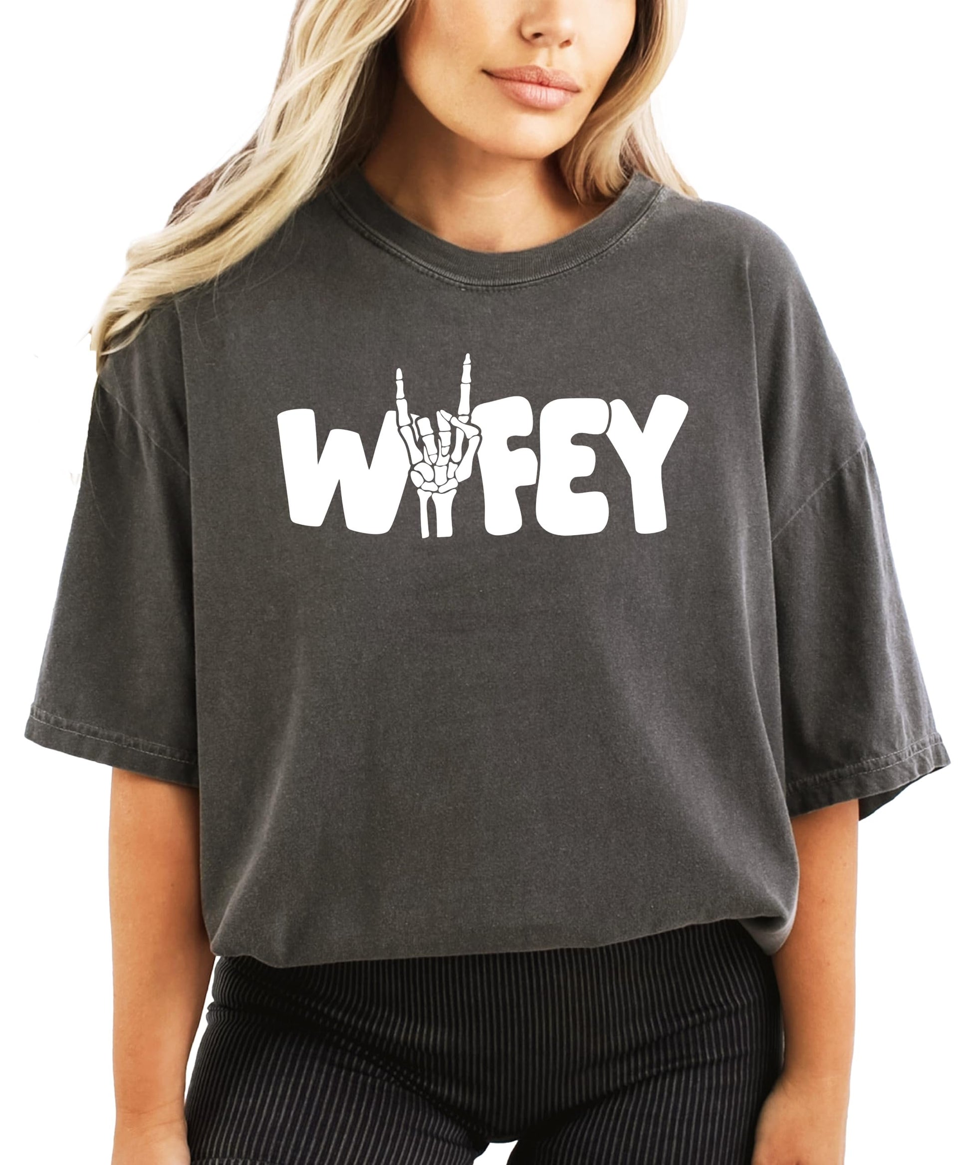 Side view of woman modeling Wifey skeleton Halloween graphic tee