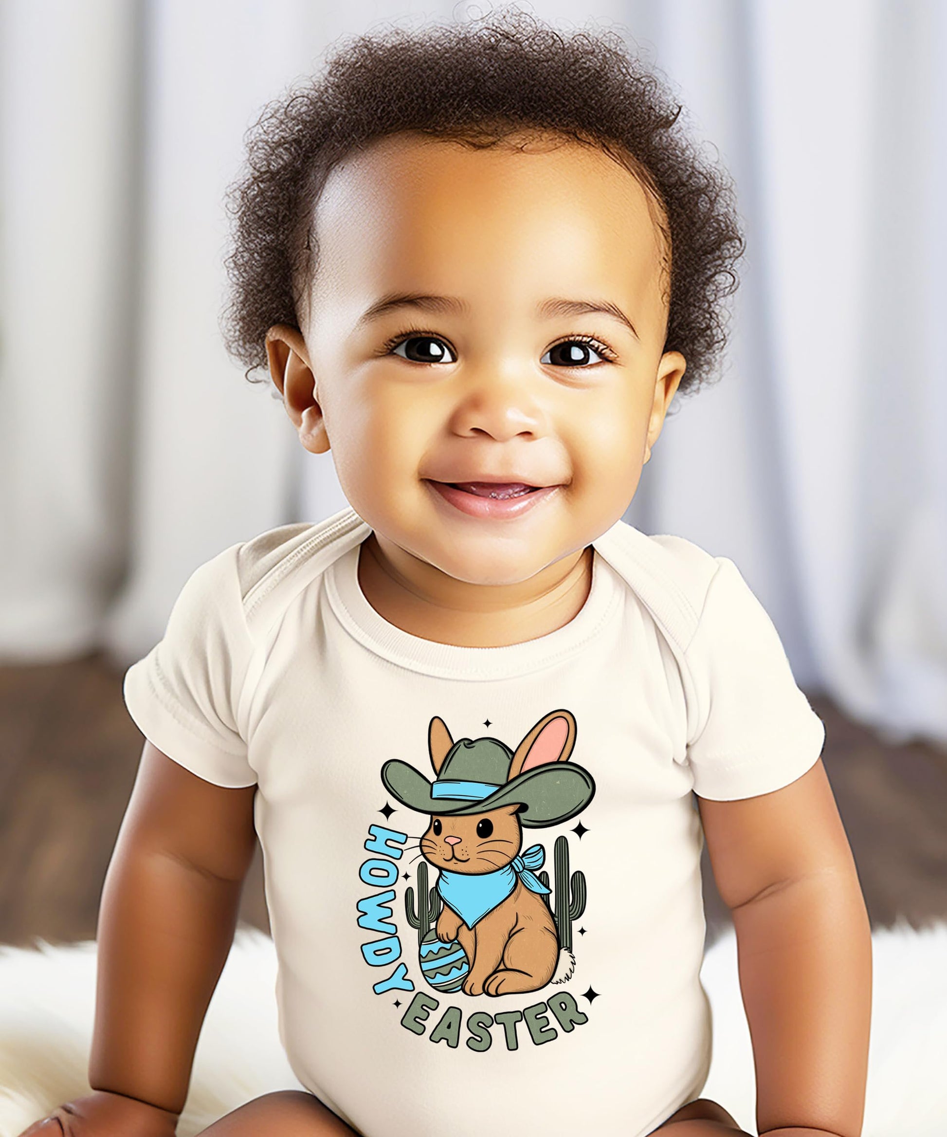 Detail view of Easter cowboy bunny graphic on natural baby bodysuit