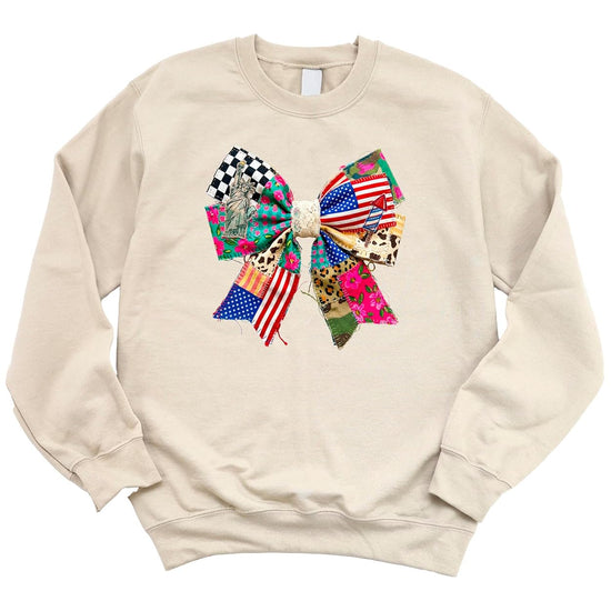 Youth and adult patriotic ribbon bow sweatshirts shown together for family matching July 4th look