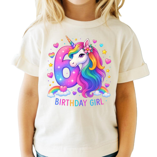 Detail shot of six year old birthday unicorn shirt print quality on pink graphic tee