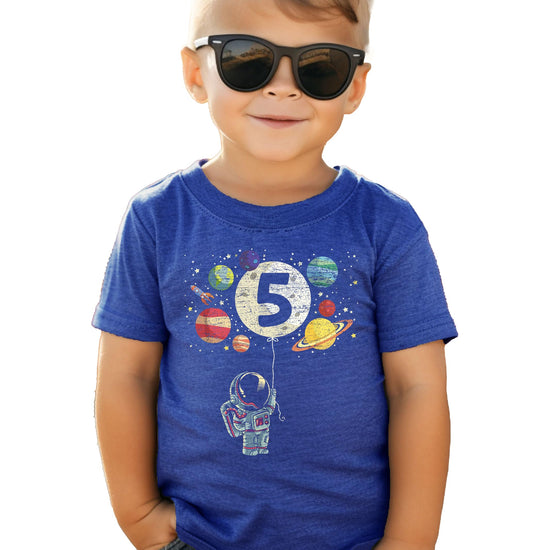 Detail shot of outer space birthday graphic tee print quality on royal blue youth shirt