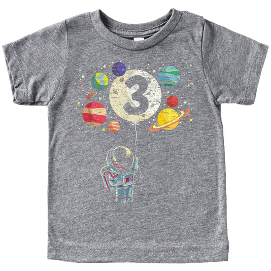 Kids black graphic tee featuring astronaut and moon balloon birthday design