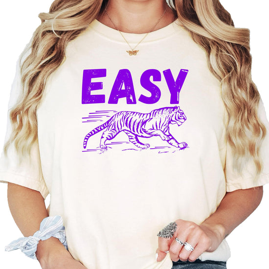 Close-up of Easy Tiger purple graphic print on ivory women's t-shirt