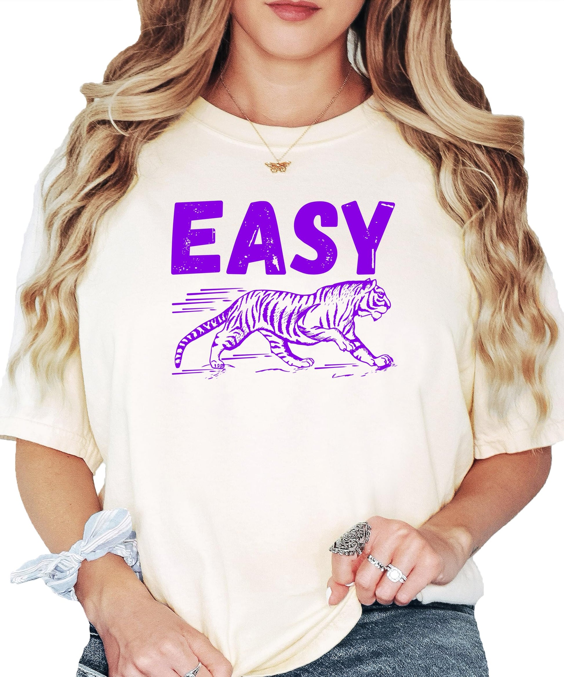Close-up of Easy Tiger purple graphic print on ivory women's t-shirt