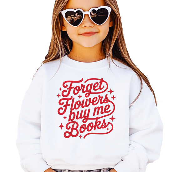 Model wearing Forget Flowers Buy Me Books white sweatshirt, cozy funny Valentine's Day bookworm apparel