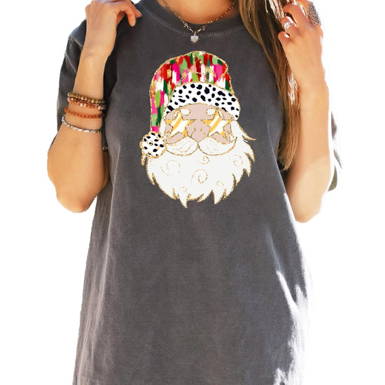Detail shot of high-quality Santa with gold sunglasses print on women's ivory Christmas graphic tee