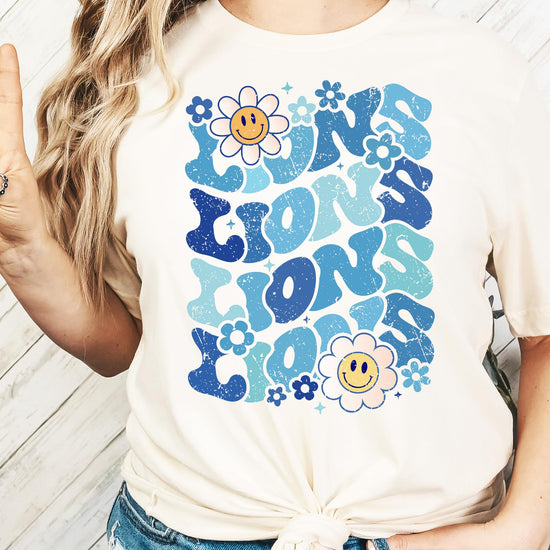 Woman wearing blue Lions mascot graphic tee casual styling