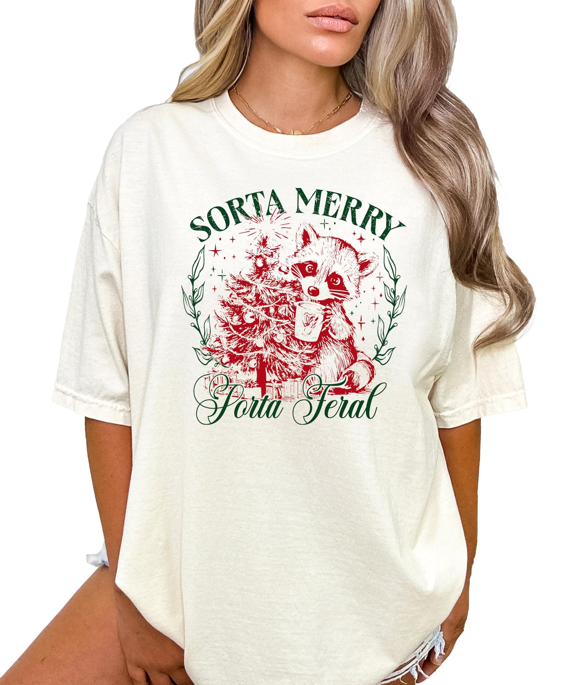 Flat lay of ivory Sorta Merry Sorta Feral women's holiday graphic tee showing full print detail