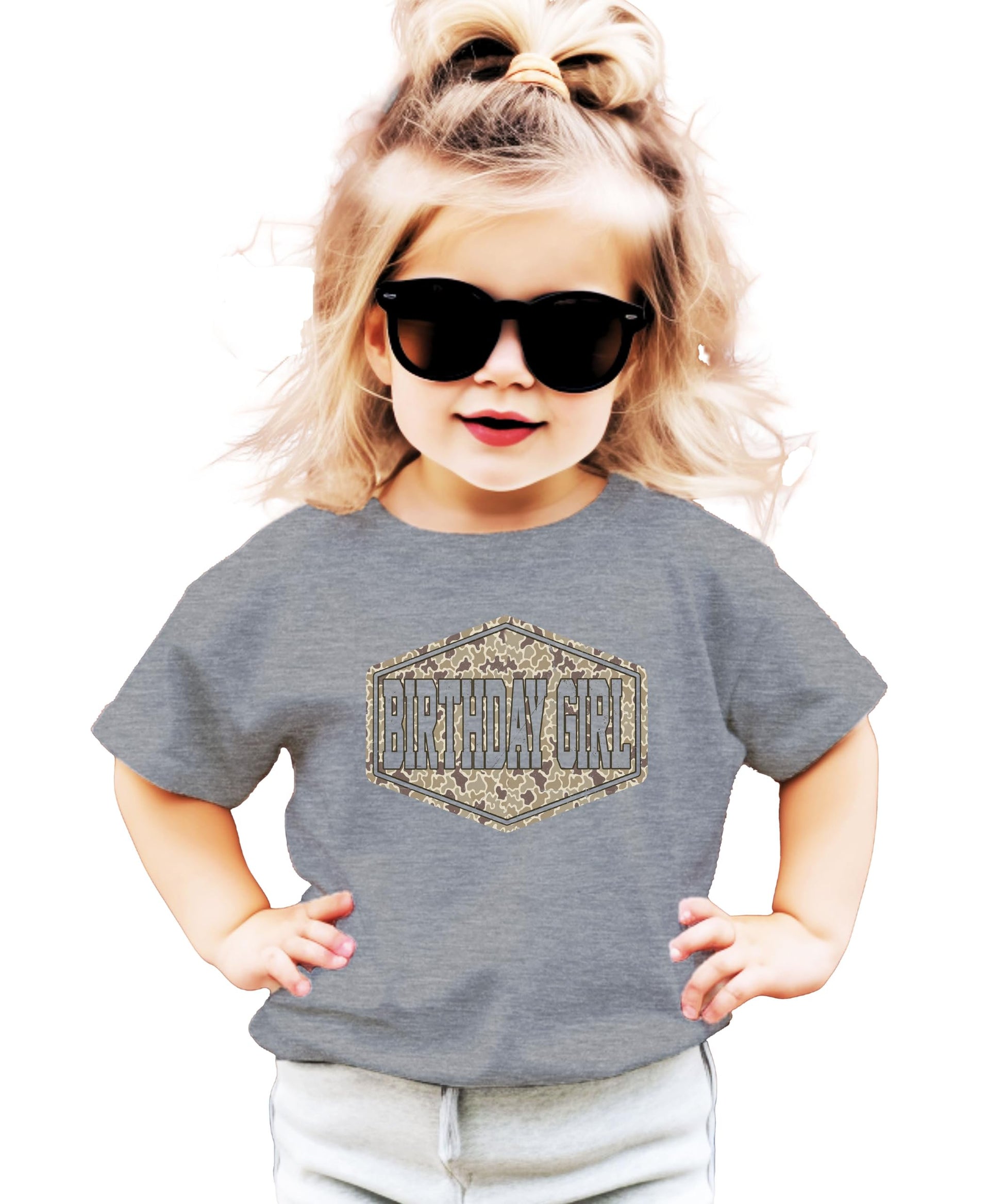 Side or back view of camo birthday girl natural graphic tee