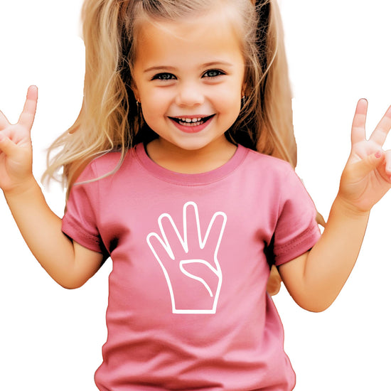 Flat lay of unisex black birthday shirt for 4 year olds with colorful design