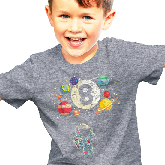Child wearing Olive Loves Apple 8th birthday rocket astronaut t-shirt