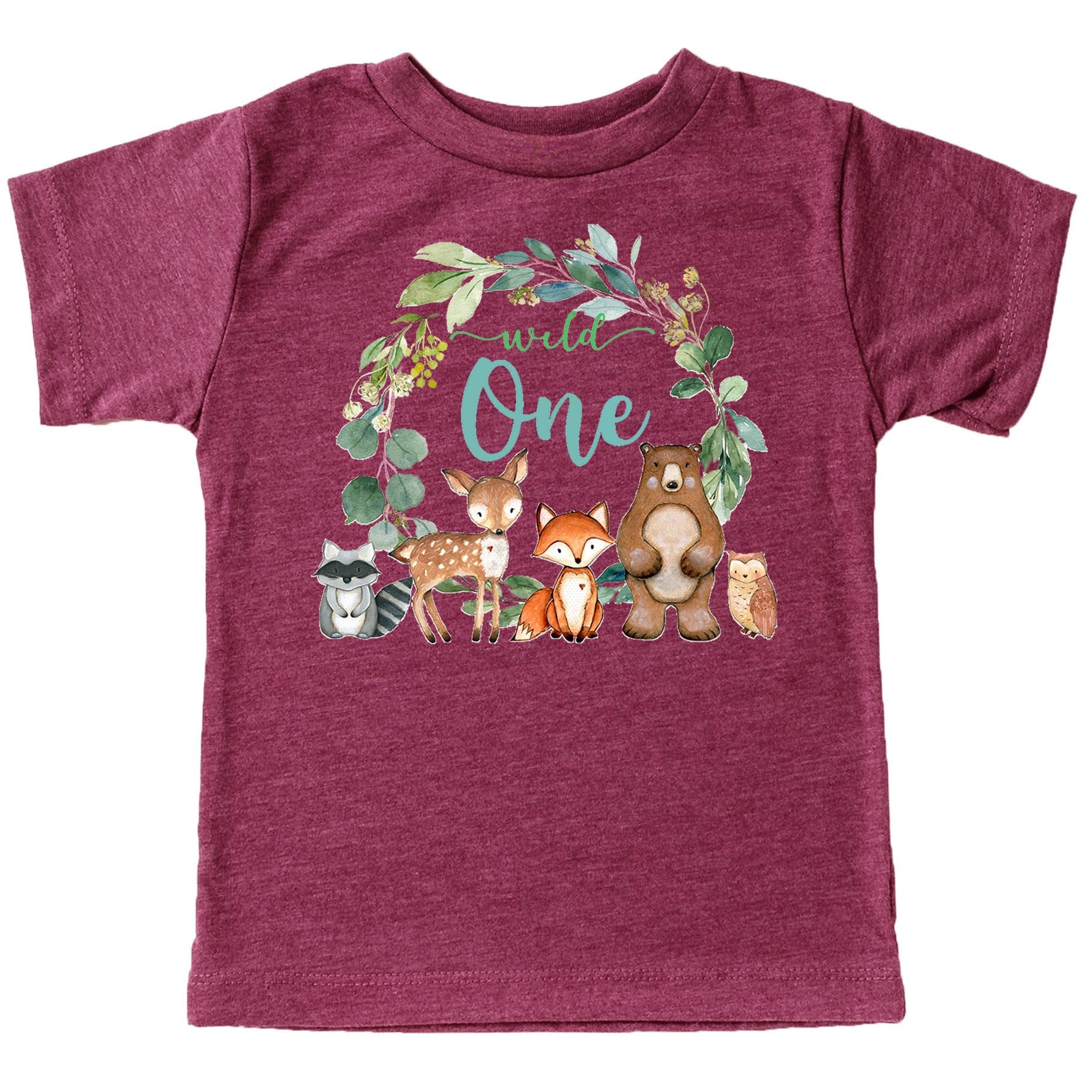 Wild One first birthday t-shirt flat lay showing wreath design with woodland creatures