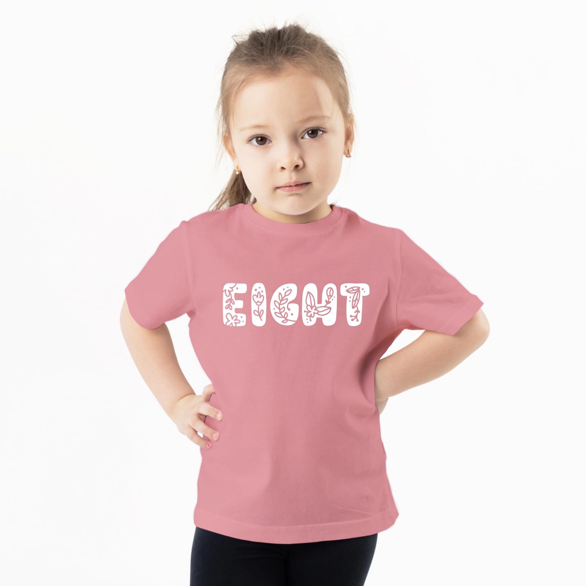 Side detail of girls floral 8th birthday graphic shirt pink flower design