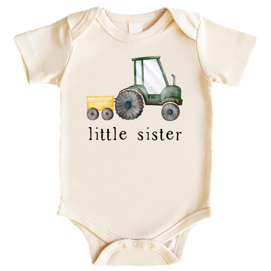 Natural baby bodysuit with little sister farm tractor graphic for sibling reveal or birth announcement