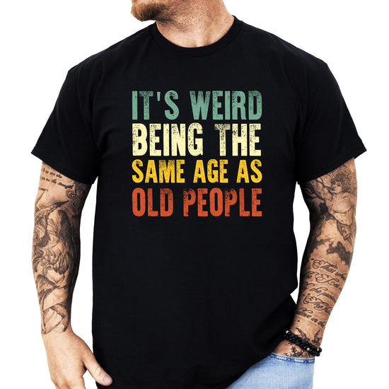 Front view of funny aging humor men's t-shirt in dark gray heather cotton