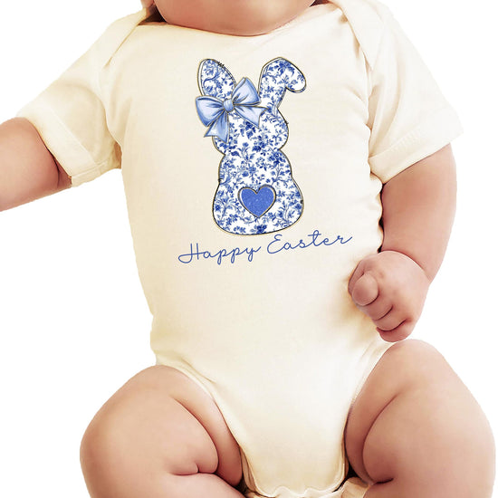 Infant modeling the Happy Easter chinoiserie bunny bodysuit in a spring setting