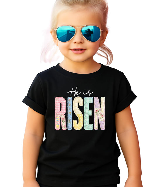 Women's pink ink-printed He Is Risen Christian Easter graphic tee from Olive Loves Apple