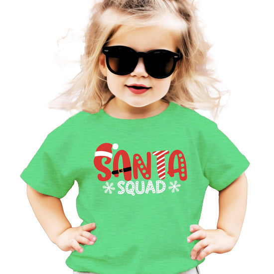 Santa Squad kids Christmas shirt flat lay showing white graphic design on mauve fabric