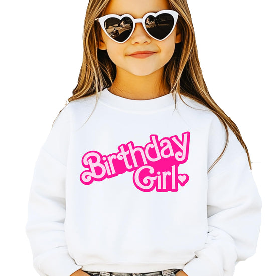 Close-up of Birthday Girl graphic print on pink youth sweatshirt