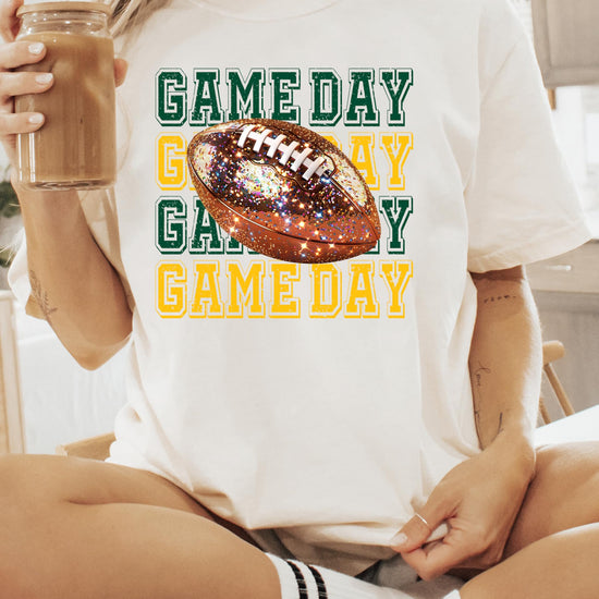 Detail shot of sparkle faux glitter Game Day football print on women's ivory tee
