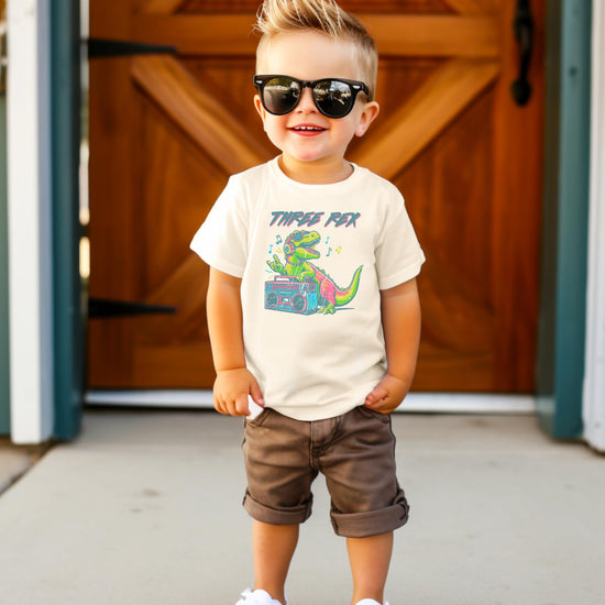 Toddler Three Rex DJ dinosaur shirt detail showing print quality and colors