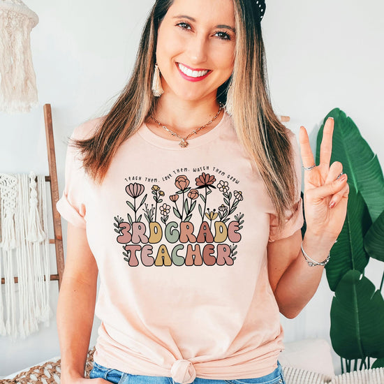 Styled photo of women's 3rd grade teacher shirt showing relaxed fit and floral print detail