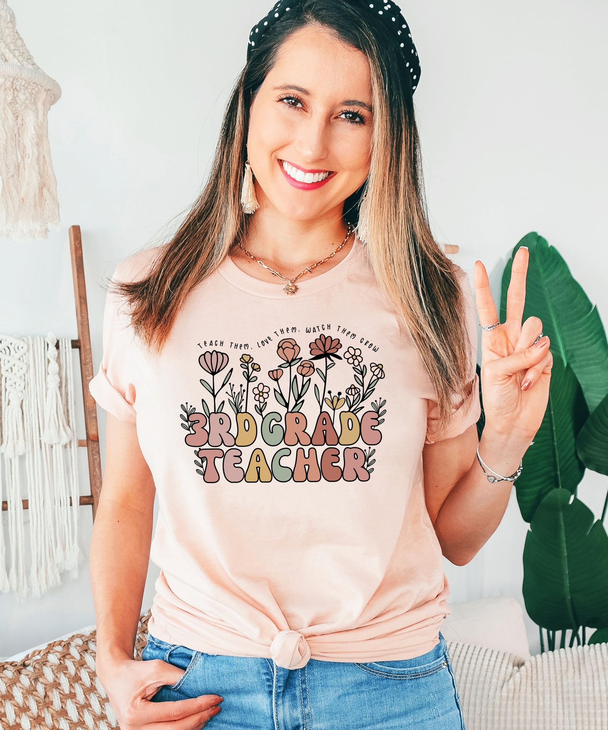 Styled photo of women's 3rd grade teacher shirt showing relaxed fit and floral print detail
