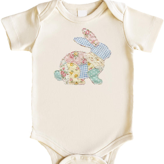 Baby bodysuit with colorful floral Easter bunny design, flat lay view
