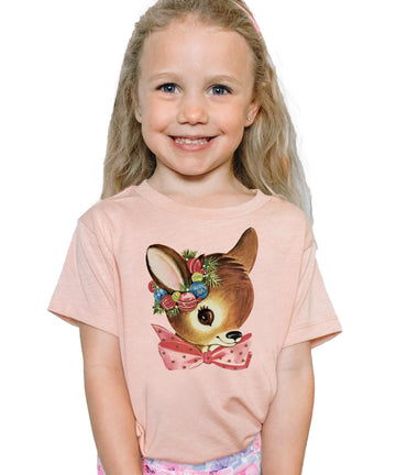 Front view of baby and toddler reindeer wreath holiday tee in peach, perfect for matching family outfits
