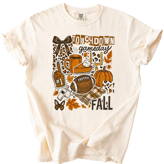 Detail shot of football and pumpkin graphics on women's fall gameday shirt