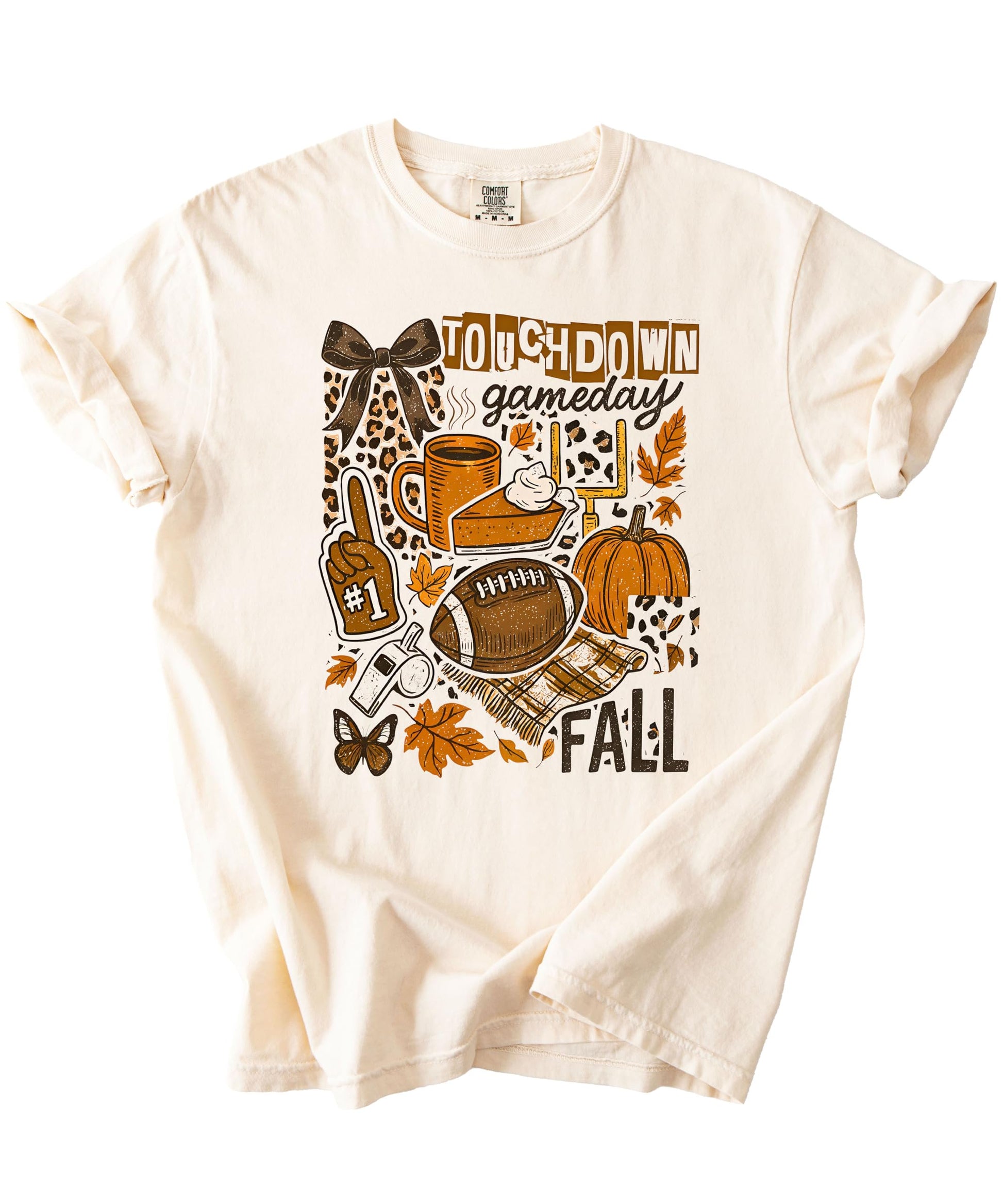 Detail shot of football and pumpkin graphics on women's fall gameday shirt