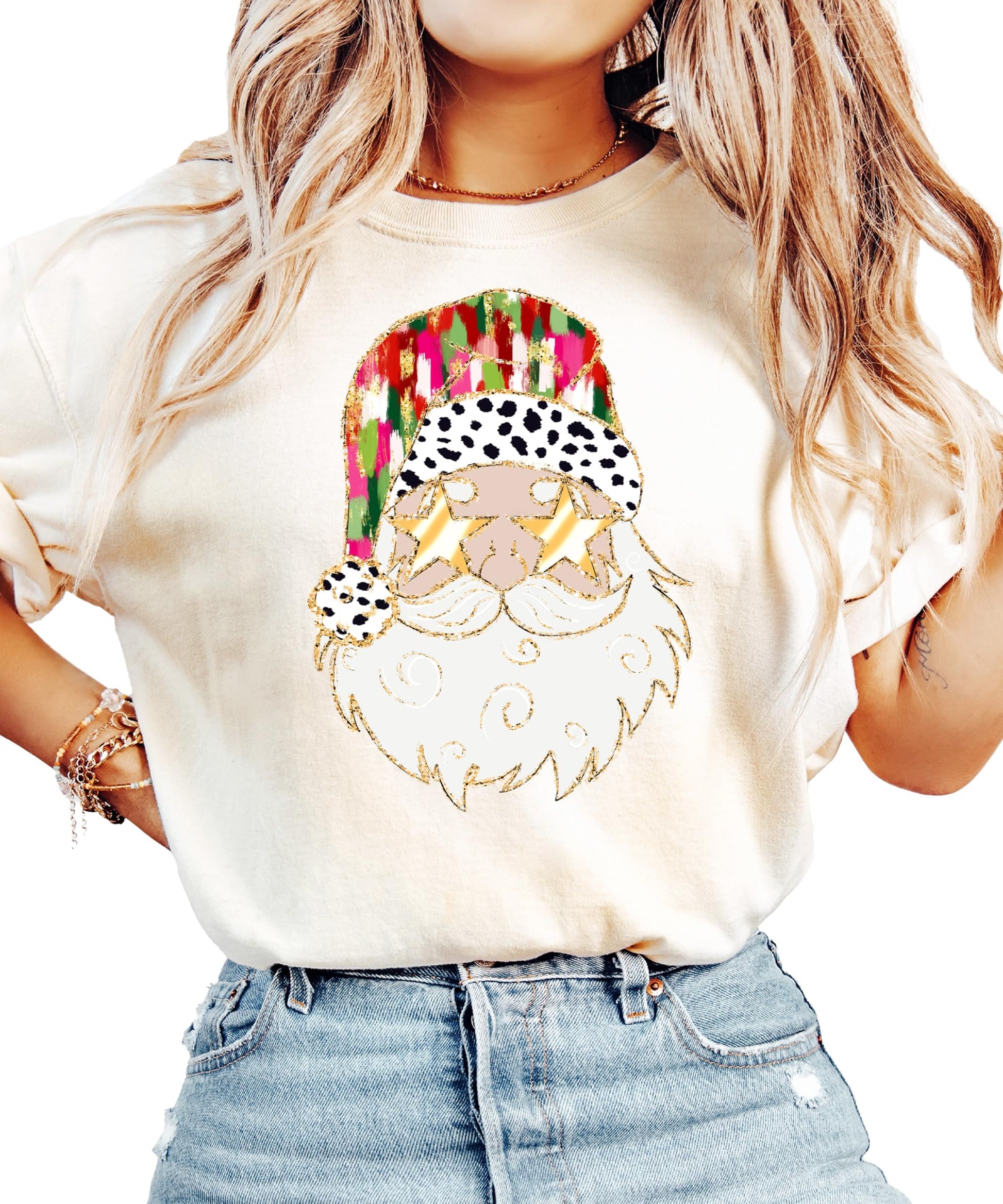Close-up of vibrant Santa with gold sunglasses print on soft ivory holiday graphic tee for women