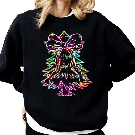 Close-up of neon Christmas tree with bow and colorful lights print on black sweatshirt