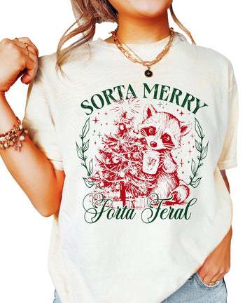 Ivory women's Christmas tee with a funny raccoon graphic and the words Sorta Merry Sorta Feral