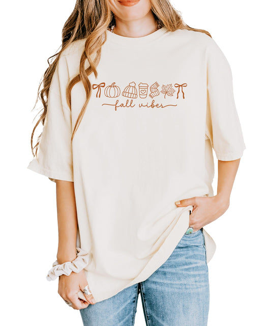 Close-up of Fall Things pumpkin and coffee graphic design print on ivory t-shirt
